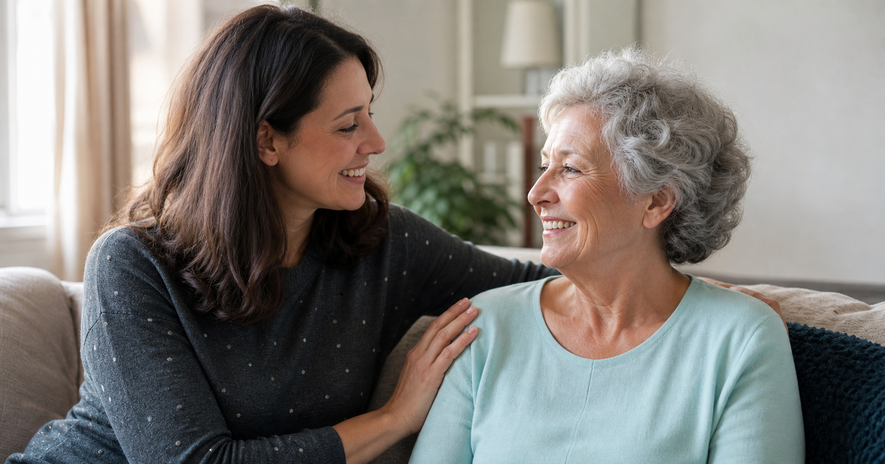 A family caregiver offering warm support to an older woman